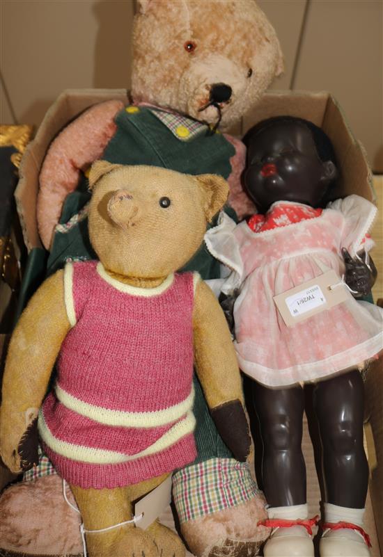 A Pedigree composition black doll, a small early 20C bear, a large bear (faded) and a Royal Artillery sweetheart pincushion